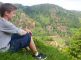 Middle school aged boy looks at vista of Costa Rican fields